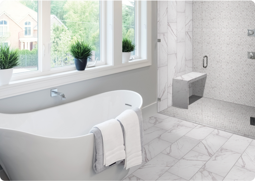 A white bathroom with soaking tub, shower and STAINMASTER Calacatta Marble-Look Floor and Wall Tile.