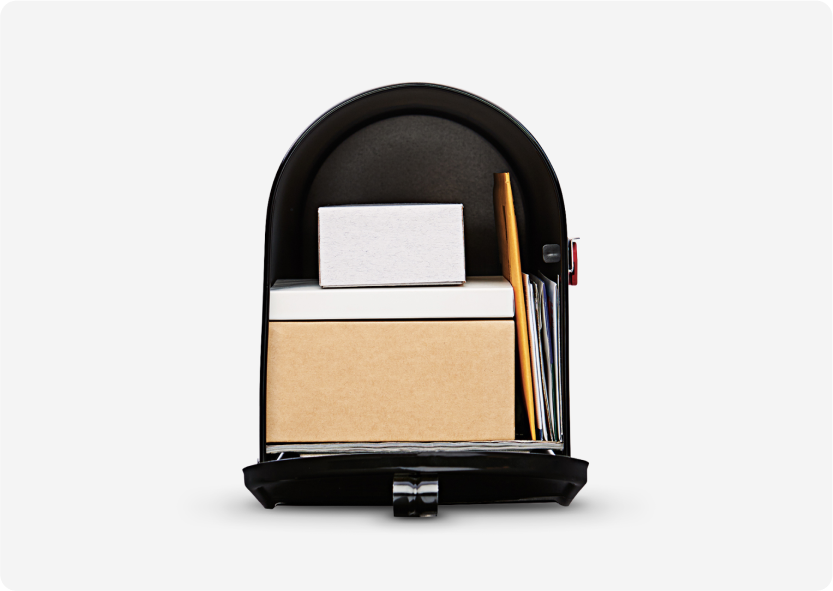 A large black mailbox full of boxes and mail.