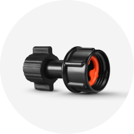 A black drip irrigation fitting.