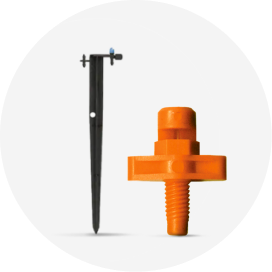 An orange drip irrigation micro spray with dripper stake.