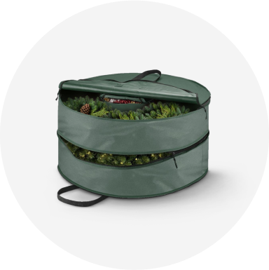 A green wreath storage bag with 2 zippered compartments.
