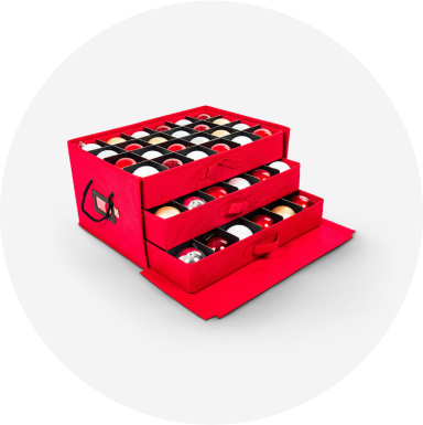 Ornaments in a red ornament storage box with 3 storage compartments.