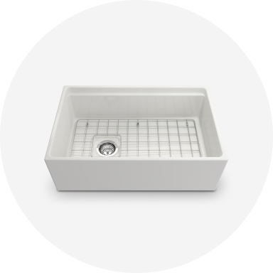 A dark blue base cabinet with nickel hardware and a speckled white countertop.